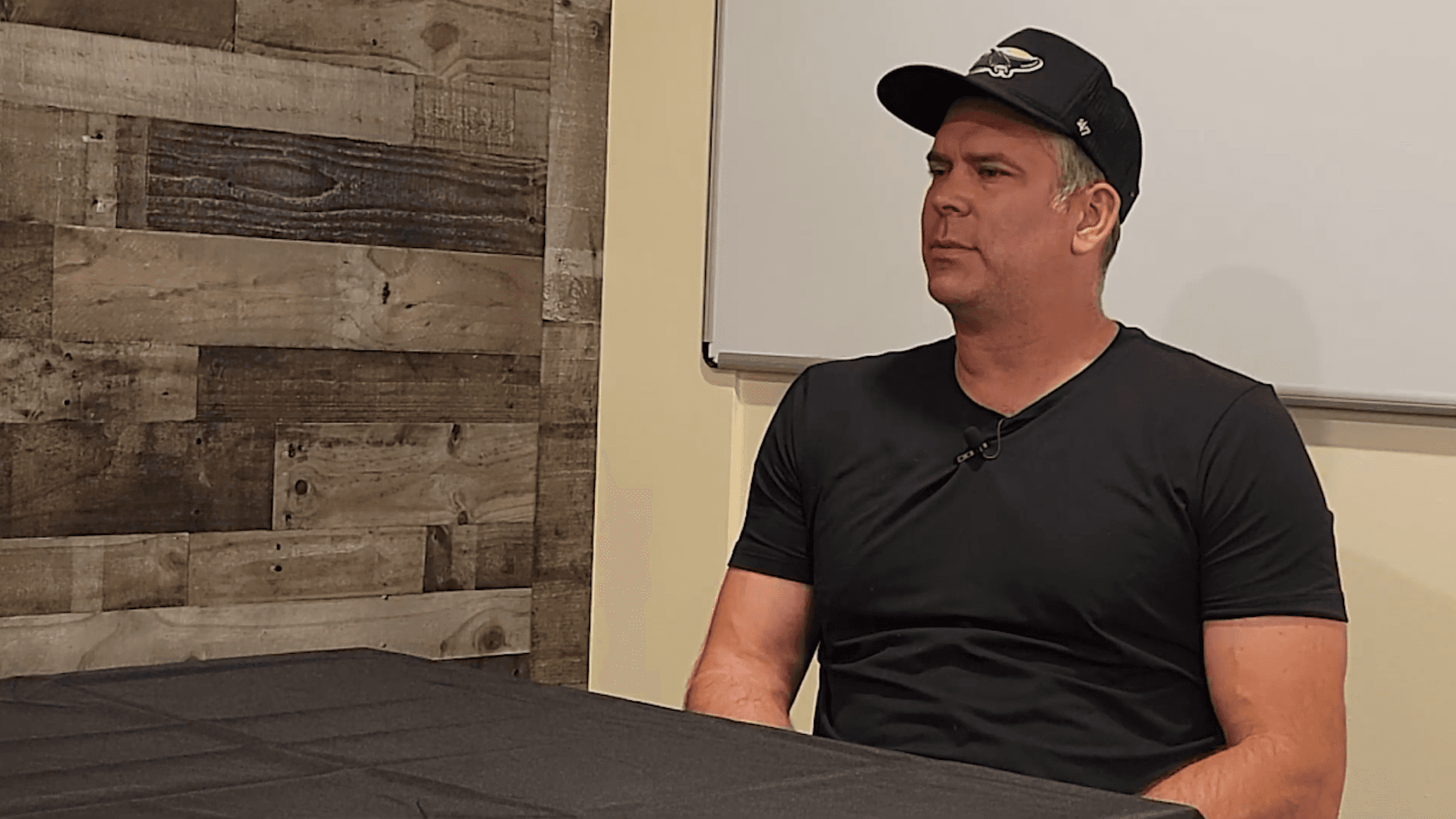 Icon Golf Carts team member seated at the table during a video interview